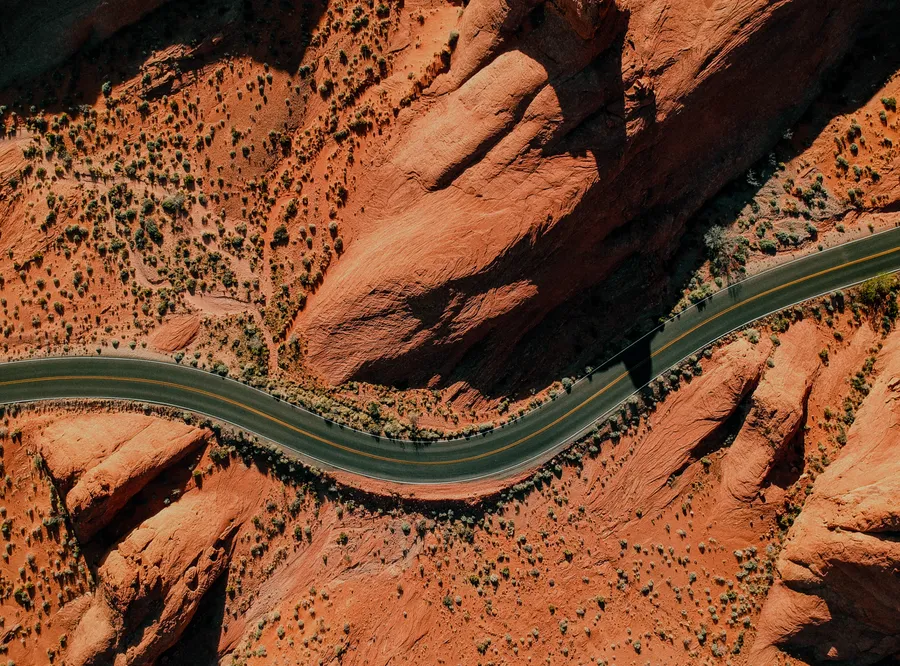 The road winding through red rock
